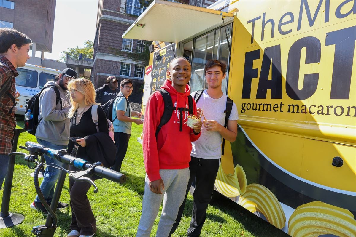 Students outside a food truck.