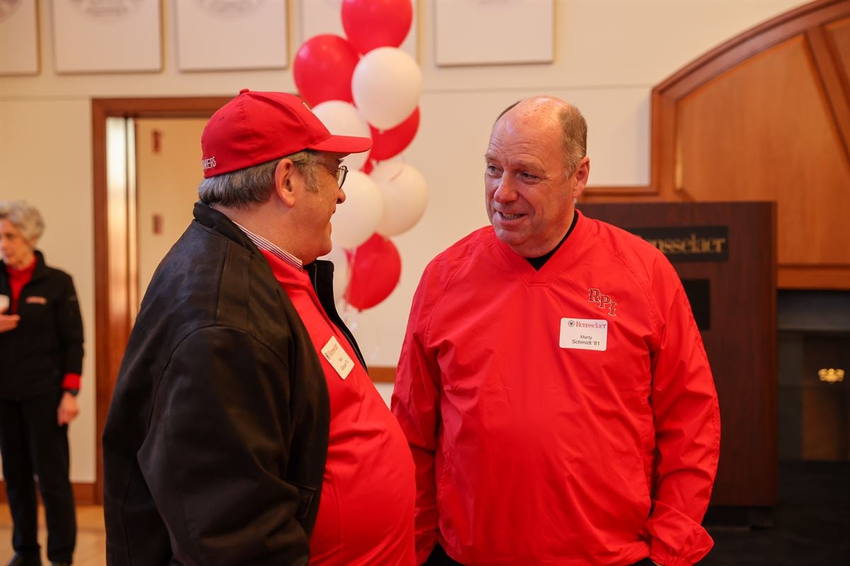 President Marty Schmidt greets a fan at the Big Red Freakout Ice House.