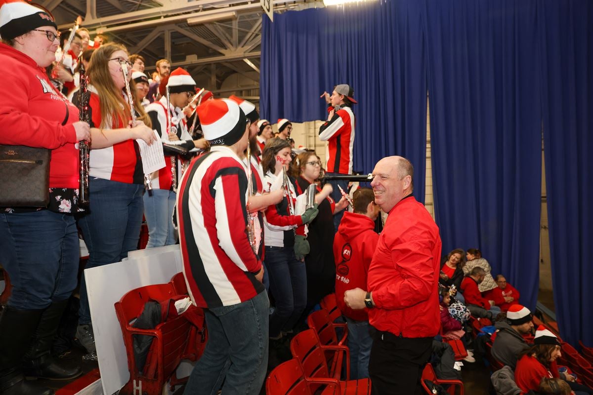President Marty Schmidt smiles at the Pep Band at the Big Red Freakout.