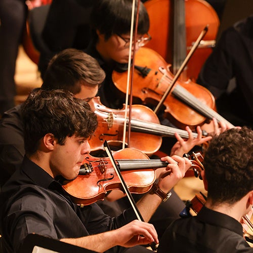 Students play violins at RPI Holiday Concert