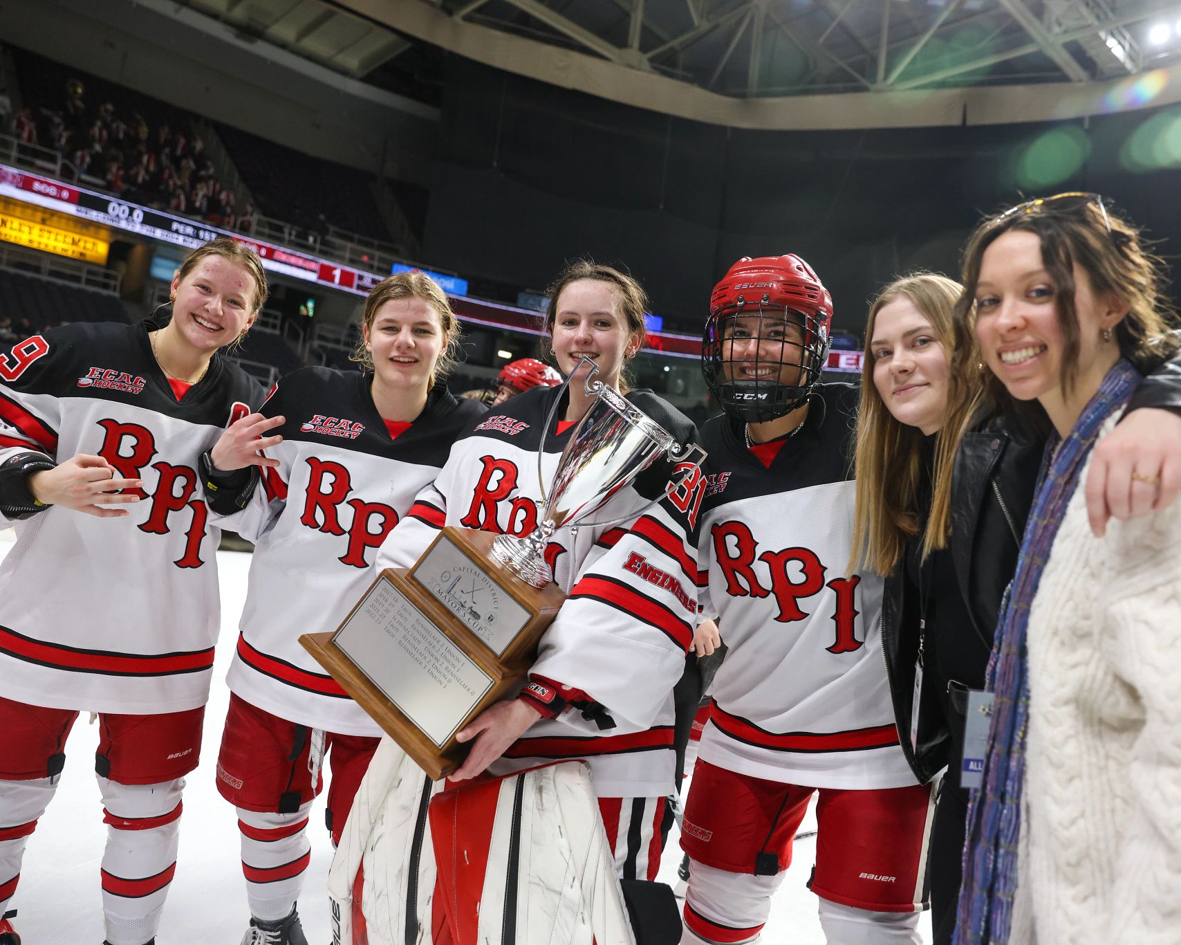 Members of the Women's Ice Hoceky team pose with the Mayor's Cup trophy