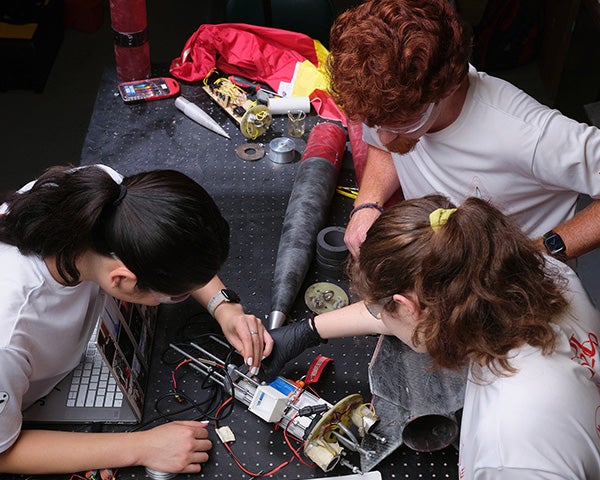 RPI Rocket Club students preparing a launch, demonstrating resilience, adaptability, and grit in hands-on aerospace innovation.