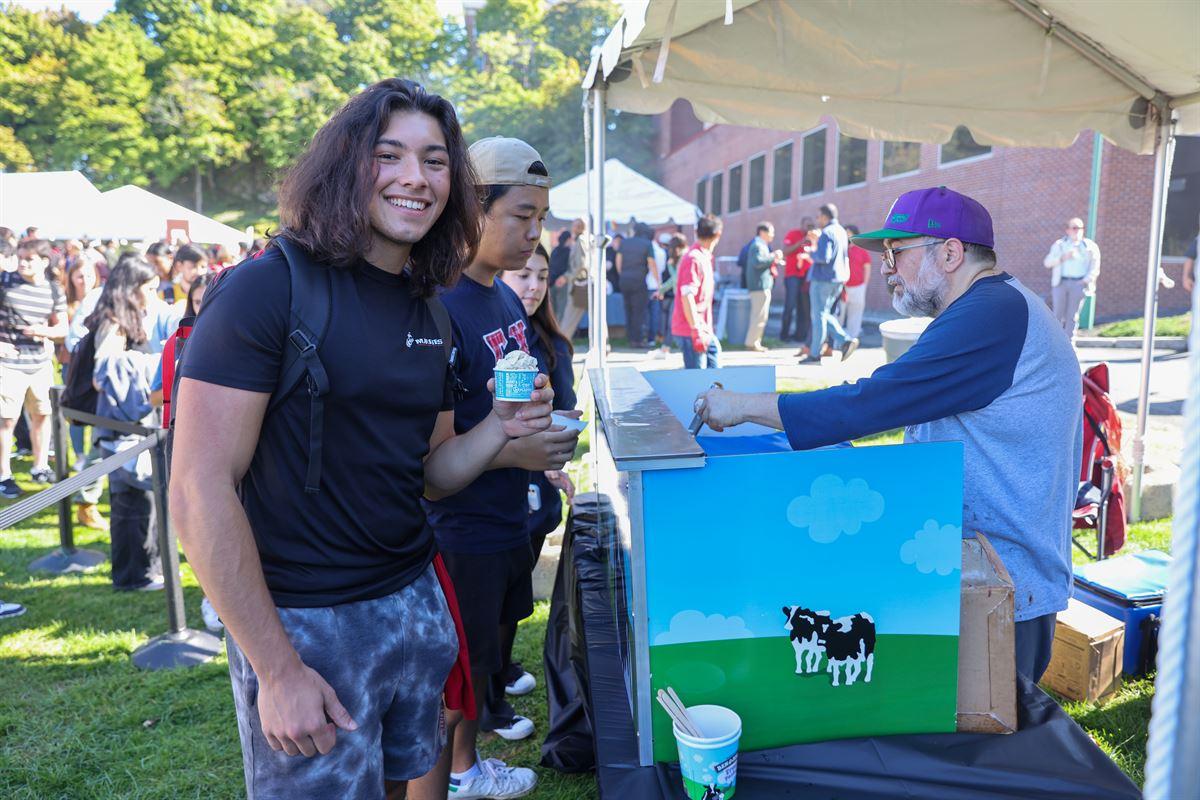 Student getting ice cream from vendor.