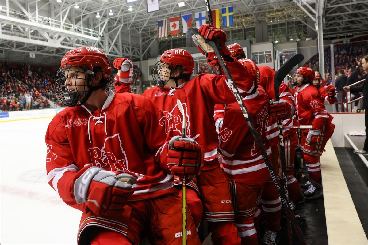 Excited hockey players behind the bench at the Big Red Freakout.