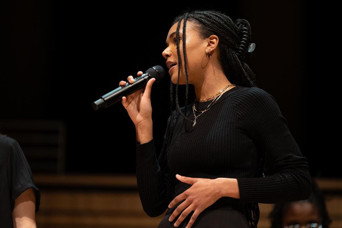 Soloist female singer on stage at the Holiday Concert.