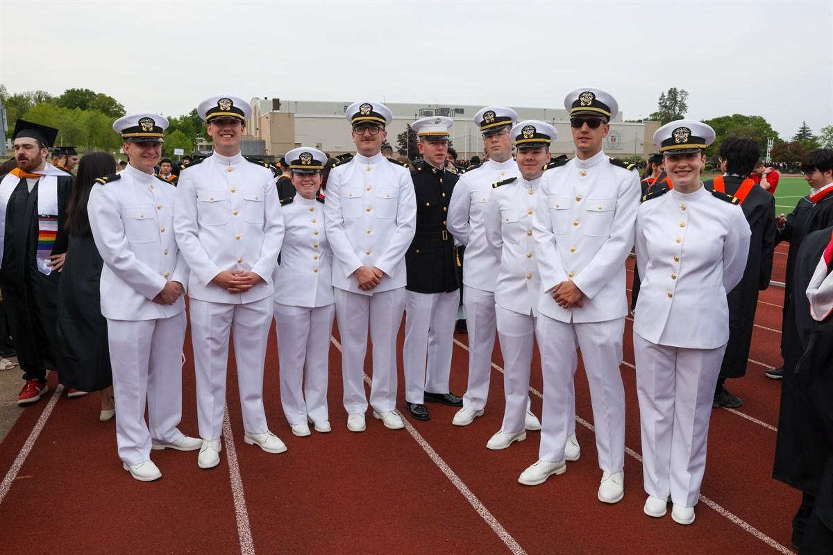 Student members of ROTC in lineup in uniform prior to start of Commencement.