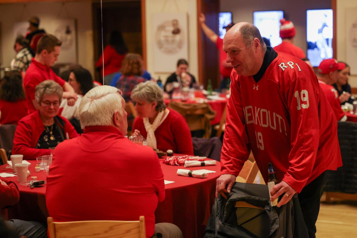 President Schmidt speaks with guests at Big Red Freakout Ice House