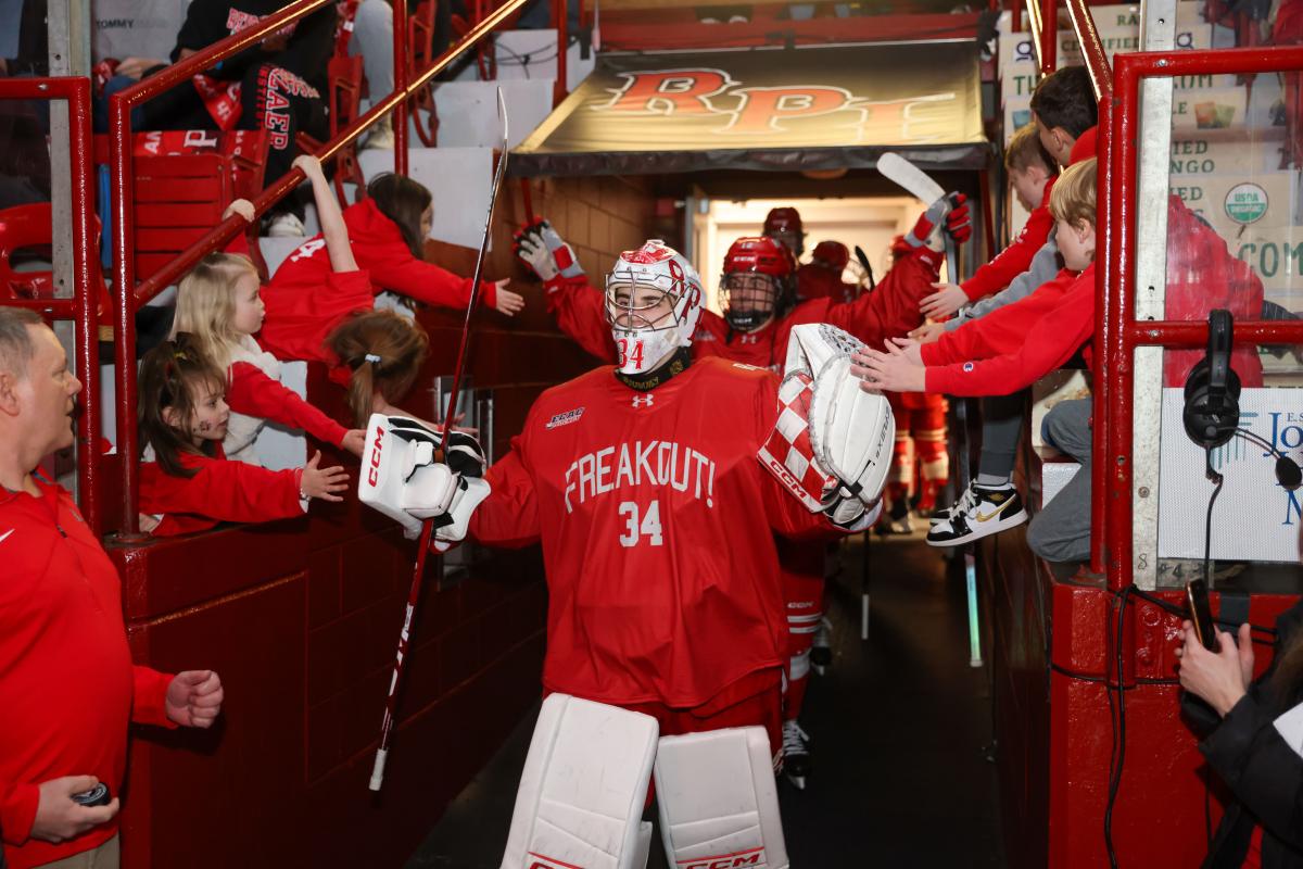 RPI hockey team members entering the ice at the Big Red Freakout.