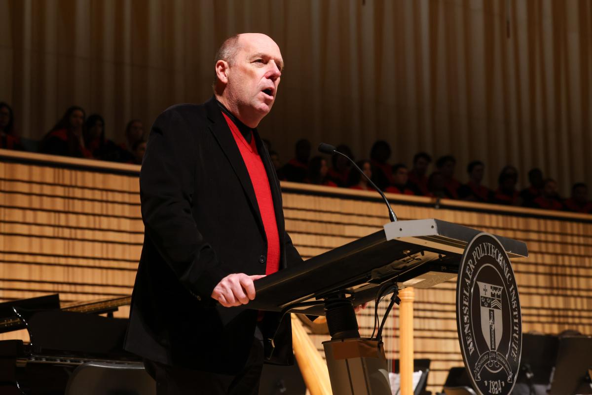 President Schmidt welcomes guests to RPI's holiday concert.