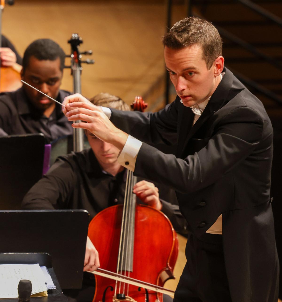 Close-up of Robert Whalen conducting the Rensselaer Orchestra.