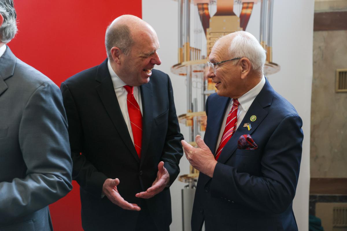 President Schmidt and Congressman Paul Tonko chat with one another at the unveiling of the IBM Quantum System One.