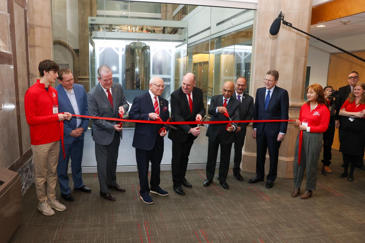 Trustee Curtis Priem, Congressman Paul Tonko, RPI President Martin Schmidt, and IBM CEO Arvind Krishna participate in a ribbon-cutting ceremony in front the IBM Quantum System One on RPI's campus.