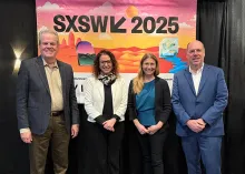 President Schmidt poses in front of SXSW 2025 banner