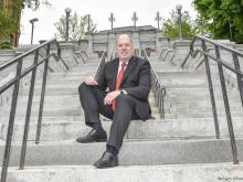 President schmidt poses on the Approach stairs