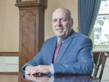 President Schmidt poses in his office