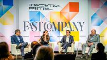 Marty Schmidt sits on stage during a four person panel at Fast Company Quantum Leap