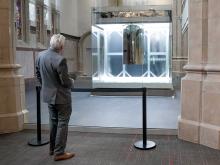Curtis R. Priem poses in front of RPI's quantum computer