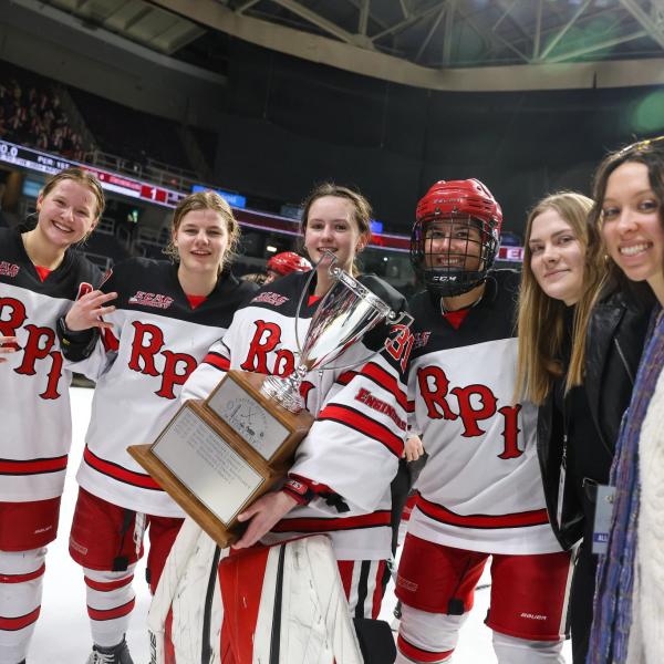 Members of the Women's Ice Hoceky team pose with the Mayor's Cup trophy