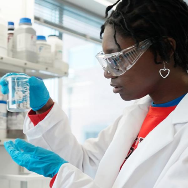 RPI student conducting research in a lab, representing the institute’s legacy of groundbreaking discoveries and life-changing innovations